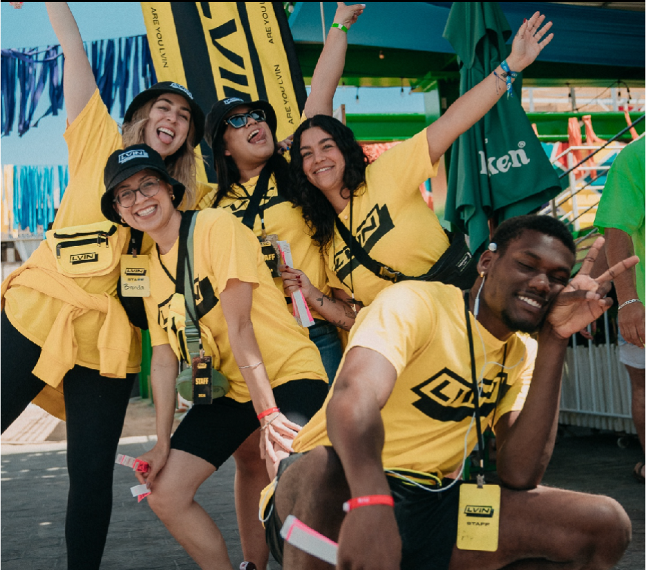 LVIN staff in yellow tees cheering at Rosarito Beach